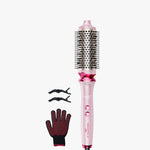 Pink hair styling tool with attachments on a white background